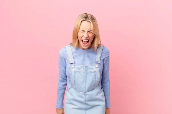 Young Blonde Woman Shouting Aggressively Looking Very Angry — Stock Photo, Image