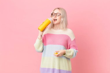 blond pretty woman with a smoothy
