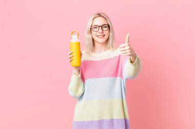 blond pretty woman with a smoothy