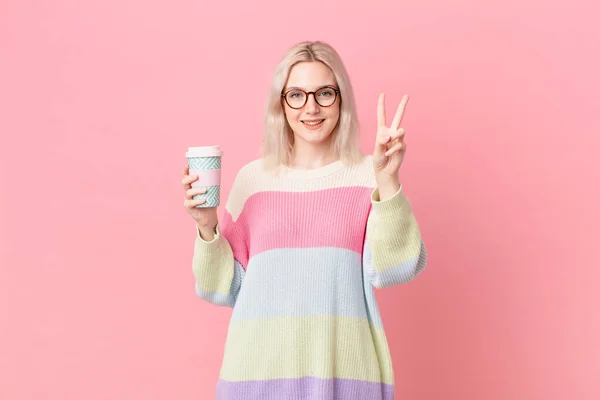 Blond Pretty Woman Smiling Looking Happy Gesturing Victory Peace Coffee — Foto Stock