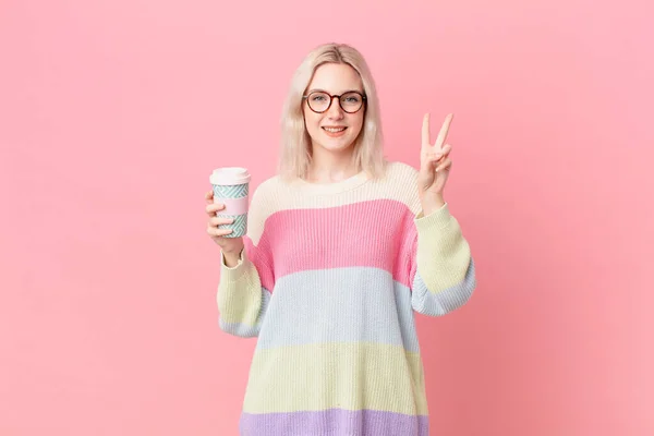 Blond Pretty Woman Smiling Looking Friendly Showing Number Two Coffee — Foto Stock