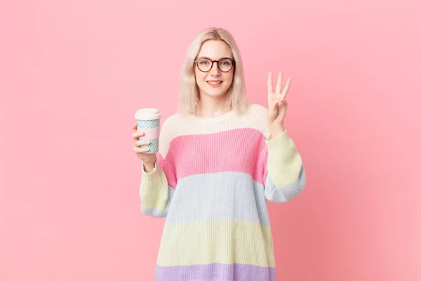 Blond Pretty Woman Smiling Looking Friendly Showing Number Three Coffee — Foto Stock