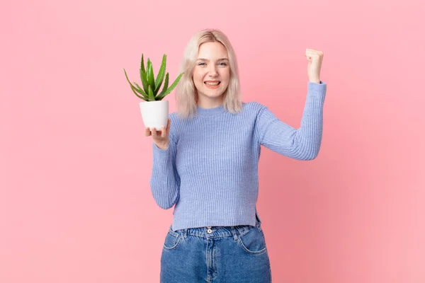 Blond Woman Holding Cactus — ストック写真