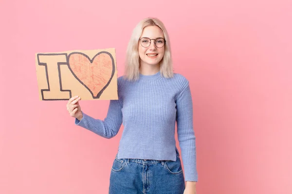 Blond Woman Holding Love Banner —  Fotos de Stock