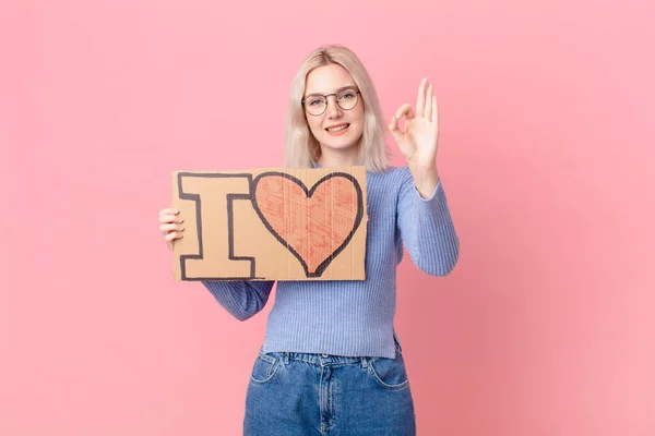 Blond Woman Holding Love Banner — Stock Photo, Image