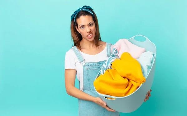 Young Hispanic Woman Feeling Puzzled Confused Washing Clothes — Stok Foto