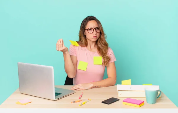 pretty woman making capice or money gesture, telling you to pay. telework concept