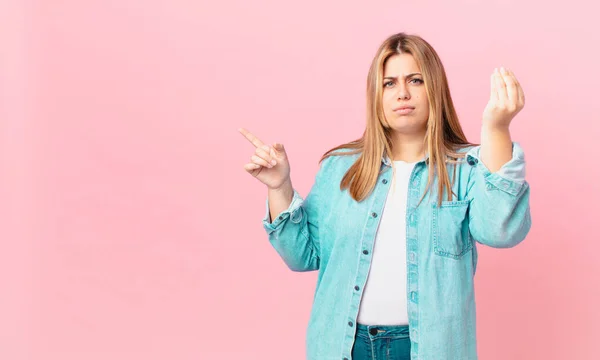 Curvy pretty blonde woman making capice or money gesture, telling you to pay — Stock Image Curvy Pretty Blonde Woman Making Capice Money Gesture Telling You Stock Photo