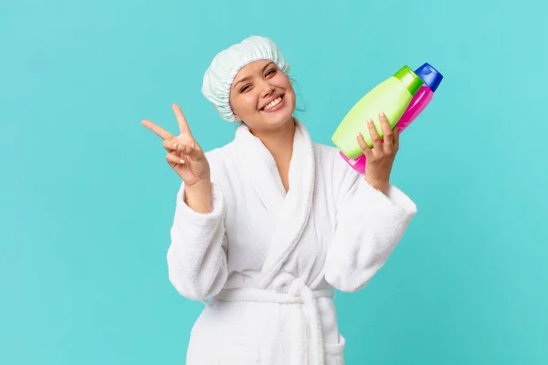 Joven Bonita Mujer Usando Albornoz Sosteniendo Una Botella Producto Limpio —  Fotos de Stock