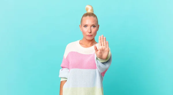 Pretty Blond Woman Looking Serious Showing Open Palm Making Stop — Stock Photo, Image