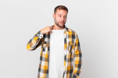 handsome blonde man feeling stressed, anxious, tired and frustrated