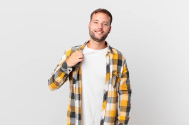 handsome blonde man looking arrogant, successful, positive and proud