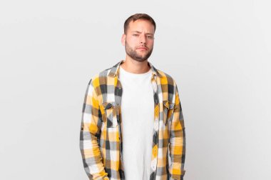 handsome blonde man feeling sad and whiney with an unhappy look and crying