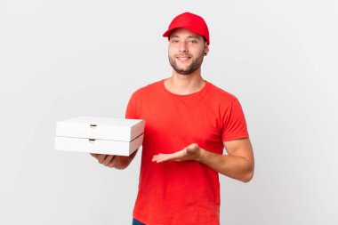 pizza deliver man smiling cheerfully, feeling happy and showing a concept