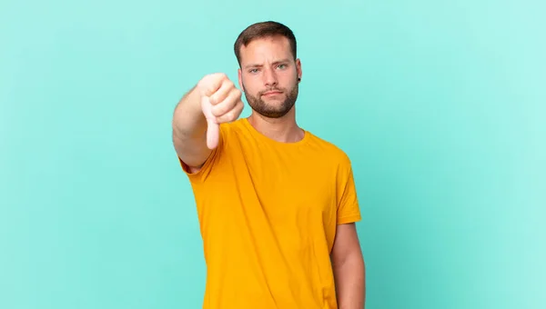 Handsome Blonde Man Feeling Cross Showing Thumbs — Stock fotografie