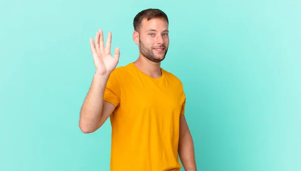 Handsome Blonde Man Smiling Happily Waving Hand Welcoming Greeting You — Foto Stock