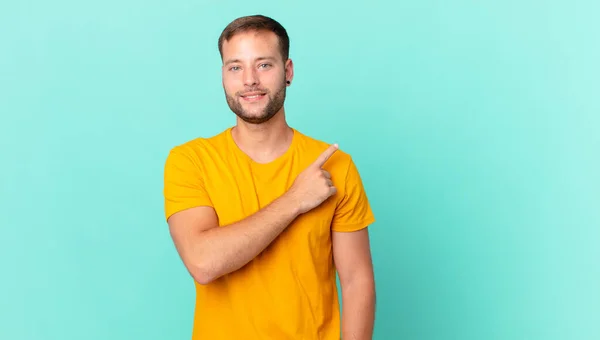 Handsome Blonde Man Smiling Cheerfully Feeling Happy Pointing Side — Stockfoto