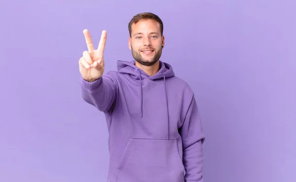 Handsome Blonde Man Smiling Looking Happy Gesturing Victory Peace — Stockfoto