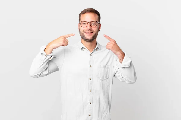 Handsome Blonde Man Smiling Confidently Pointing Own Broad Smile — Stockfoto