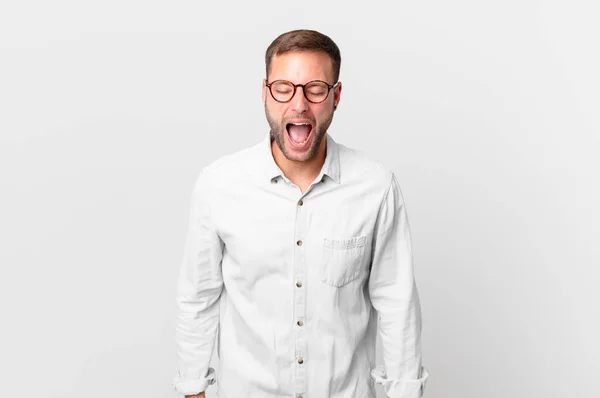 Handsome Blonde Man Shouting Aggressively Looking Very Angry — Stock Photo, Image