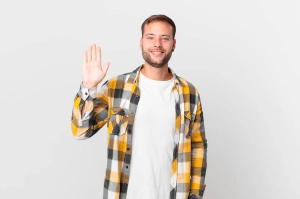 Handsome Blonde Man Smiling Happily Waving Hand Welcoming Greeting You — Φωτογραφία Αρχείου