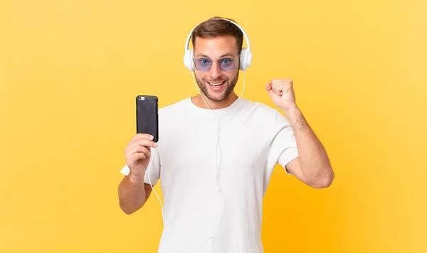 Feeling Shocked Laughing Celebrating Success Listening Music Headphones Smartphone — Stockfoto