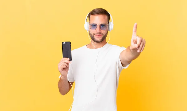 Smiling Proudly Confidently Making Number One Listening Music Headphones Smartphone — Stockfoto