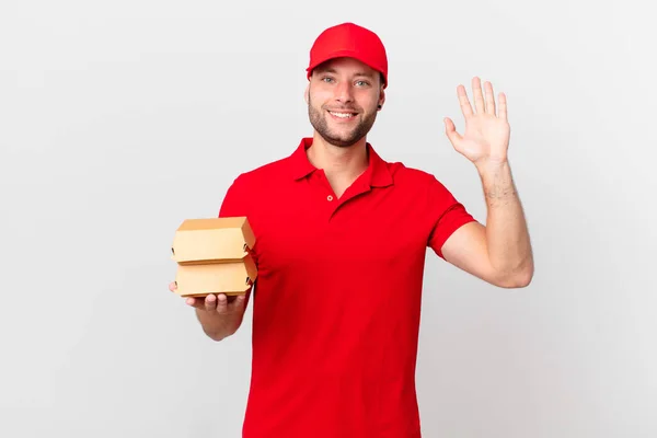 Hamburger Leveren Man Glimlachend Gelukkig Zwaaiende Hand Verwelkomen Groeten — Stockfoto