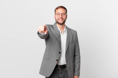 handsome businessman pointing at camera choosing you