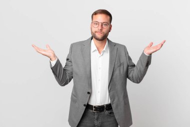 handsome businessman feeling puzzled and confused and doubting