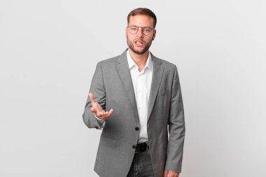 handsome businessman looking angry, annoyed and frustrated