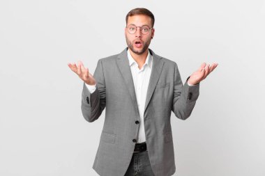 handsome businessman amazed, shocked and astonished with an unbelievable surprise
