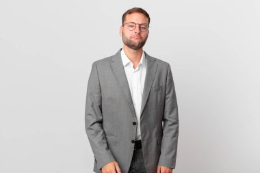 handsome businessman feeling sad and whiney with an unhappy look and crying
