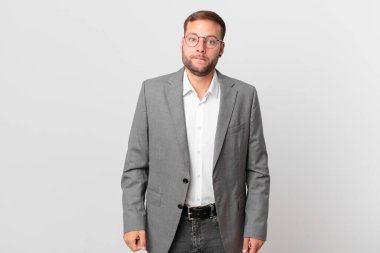 handsome businessman looking puzzled and confused