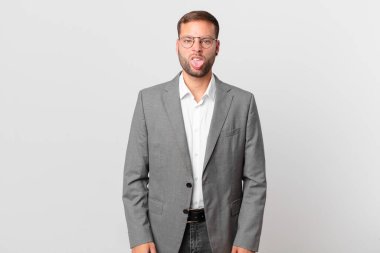 handsome businessman feeling disgusted and irritated and tongue out