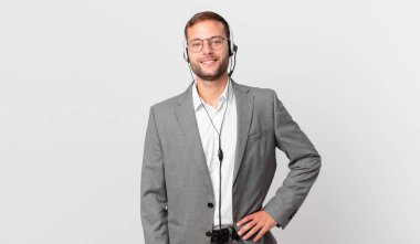 telemarketer businessman smiling happily with a hand on hip and confident