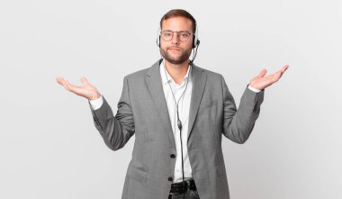 telemarketer businessman feeling puzzled and confused and doubting