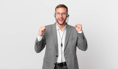 telemarketer businessman feeling shocked,laughing and celebrating success
