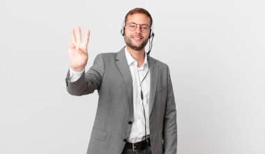 telemarketer businessman smiling and looking friendly, showing number three