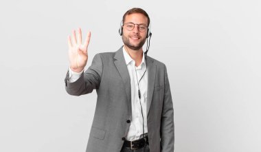 telemarketer businessman smiling and looking friendly, showing number four