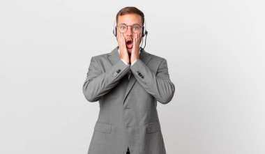 telemarketer businessman feeling shocked and scared