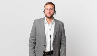 telemarketer businessman looking puzzled and confused