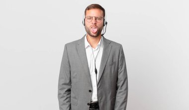 telemarketer businessman feeling disgusted and irritated and tongue out