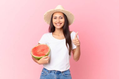 pretty woman holding a watermelon slice