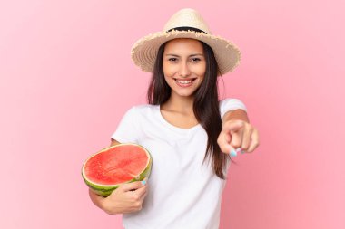 pretty woman holding a watermelon slice