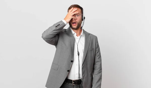 Telemarketer Businessman Looking Shocked Scared Terrified Covering Face Hand — Foto de Stock