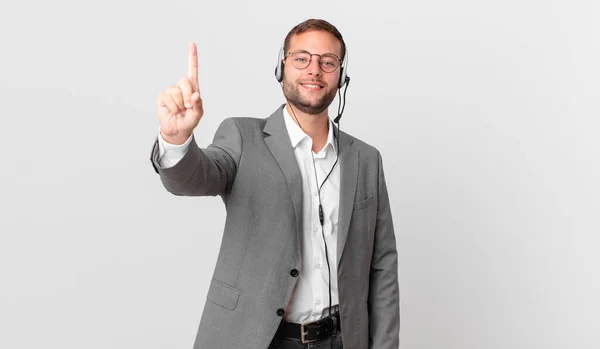 Telemarketer Businessman Smiling Looking Friendly Showing Number One — стоковое фото