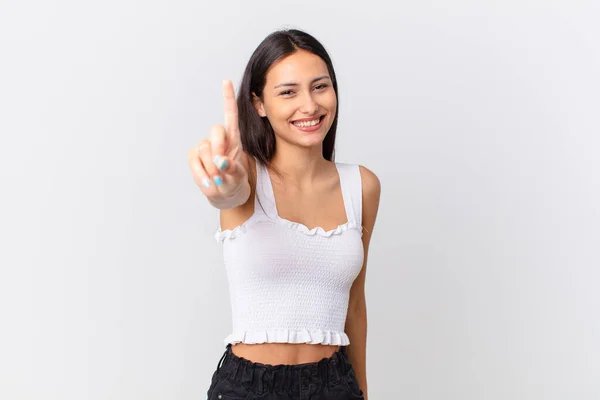 Hispanic Pretty Woman Smiling Proudly Confidently Making Number One — Stock Photo, Image