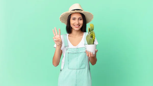 Pretty Farmer Woman Smiling Looking Friendly Showing Number Three Holding — Stockfoto