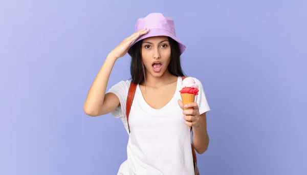 Pretty Hispanic Tourist Looking Happy Astonished Surprised Holding Ice Cream — Stockfoto